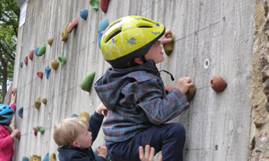 Kids climbing on the wall